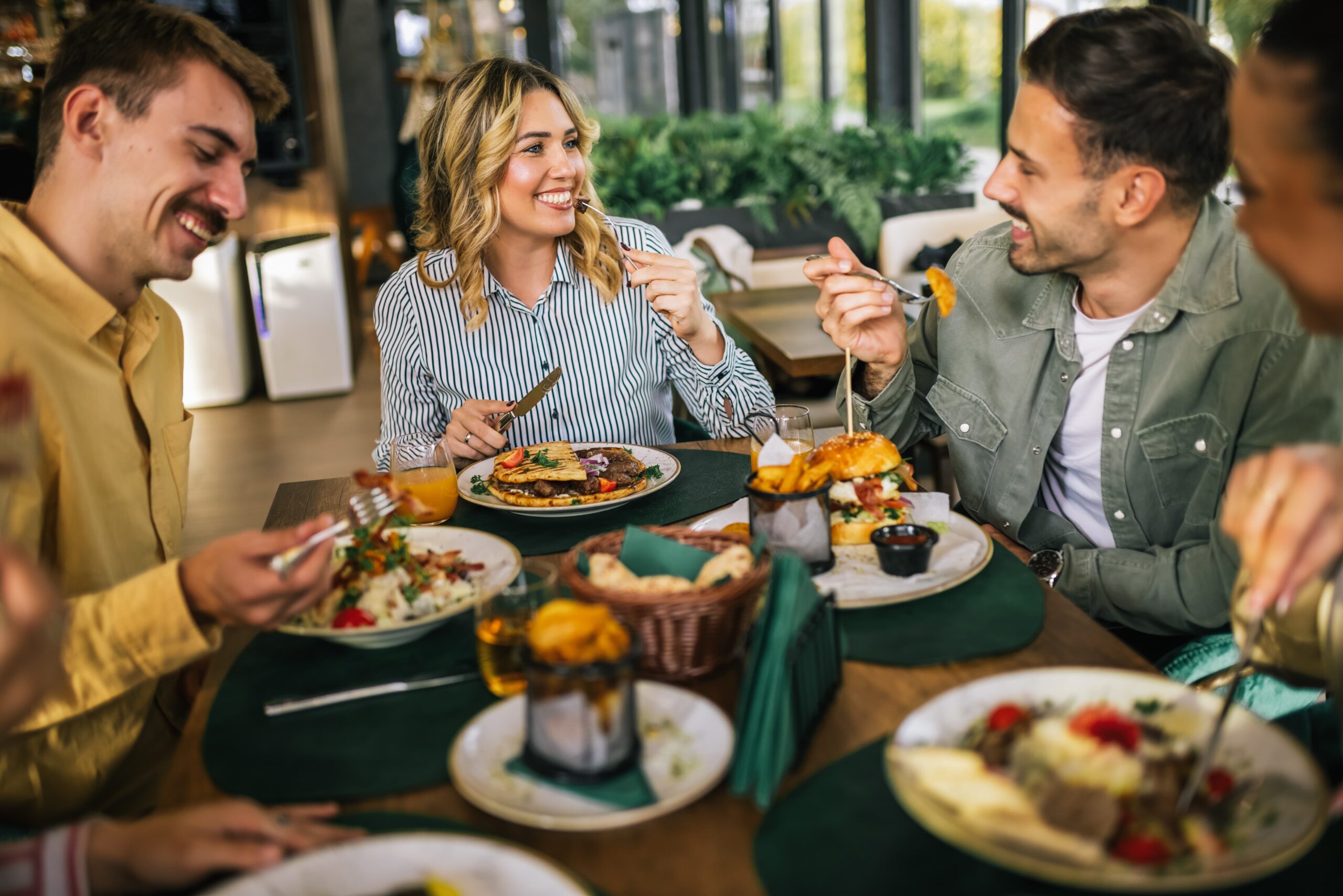 people smiling while dining