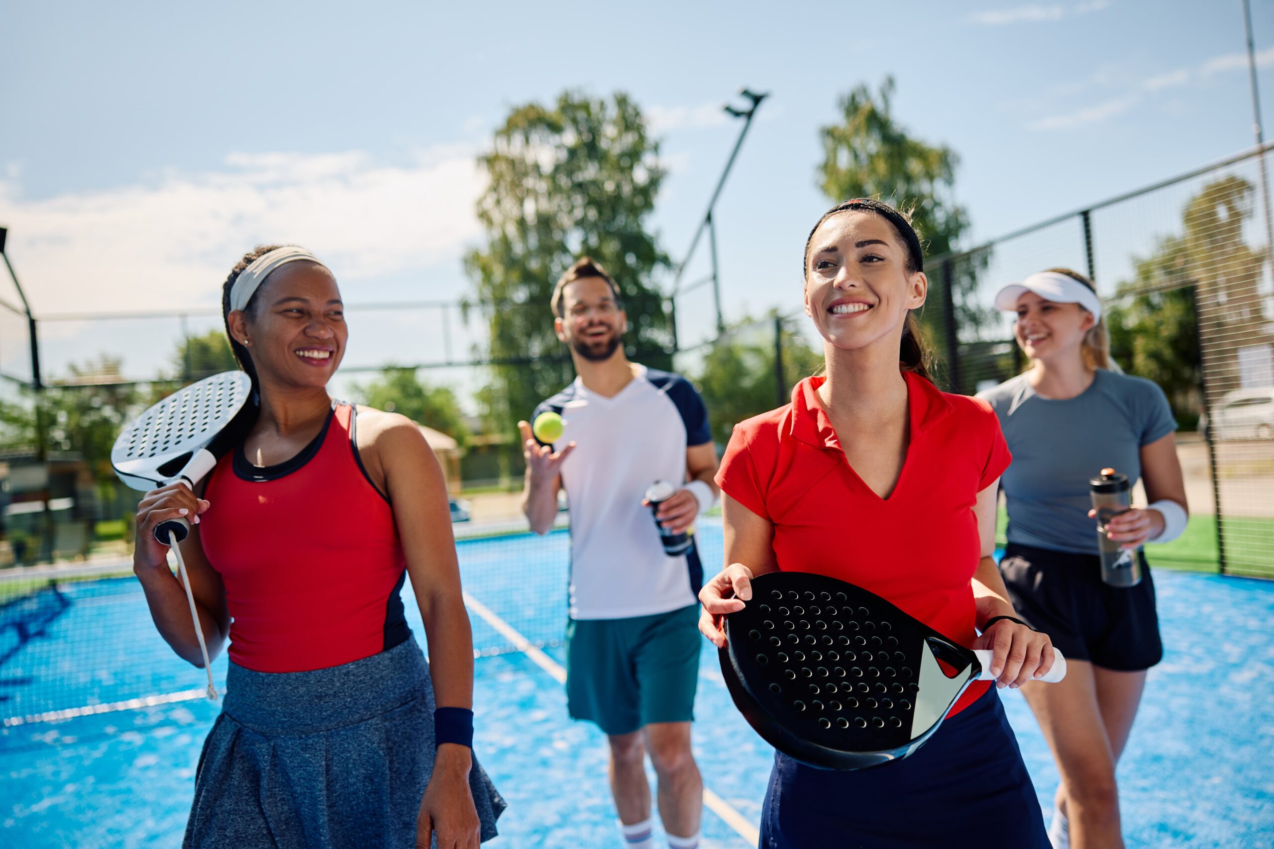people walking on tennis court